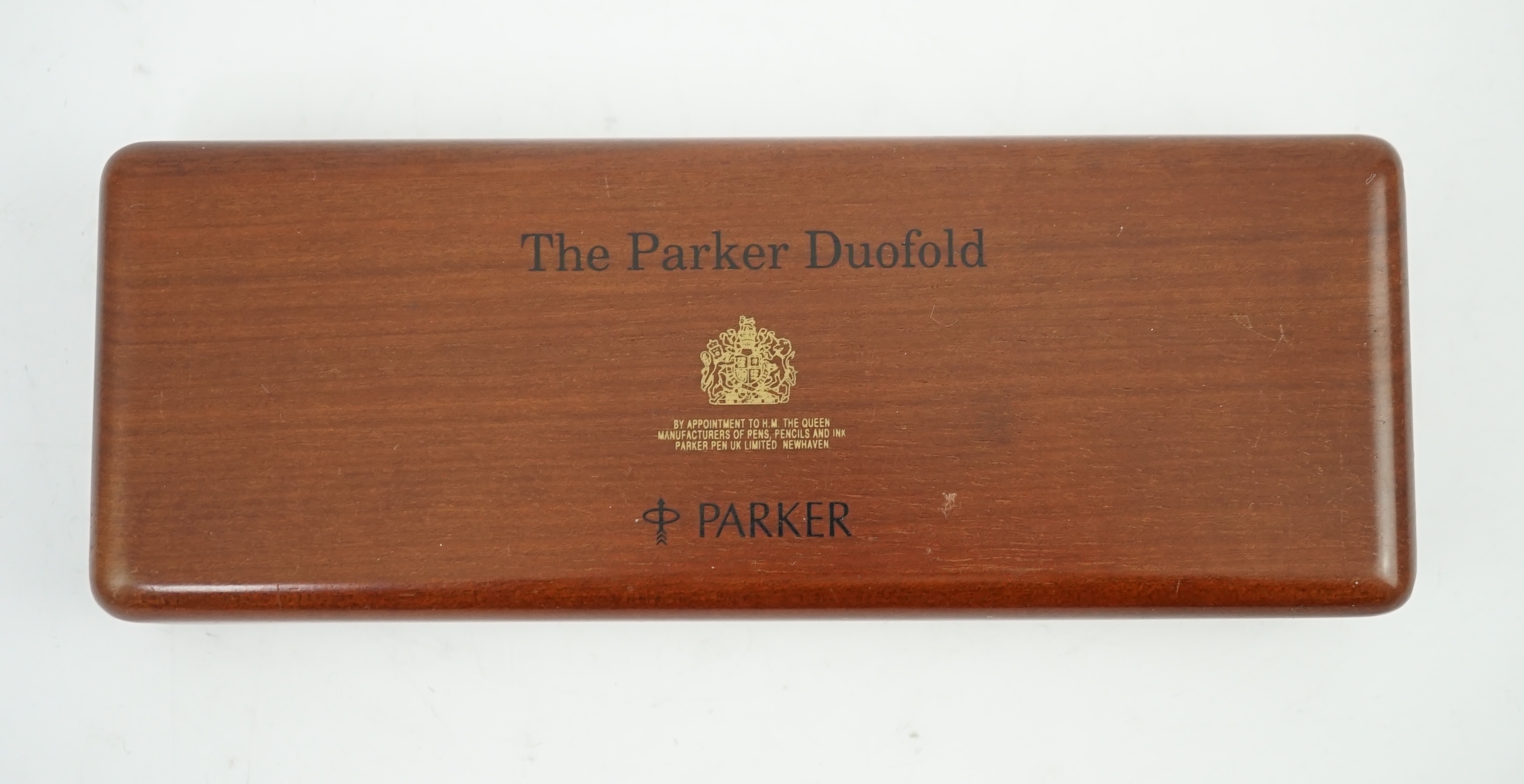 A Parker Duofold orange centennial fountain pen and pencil set, in wooden case